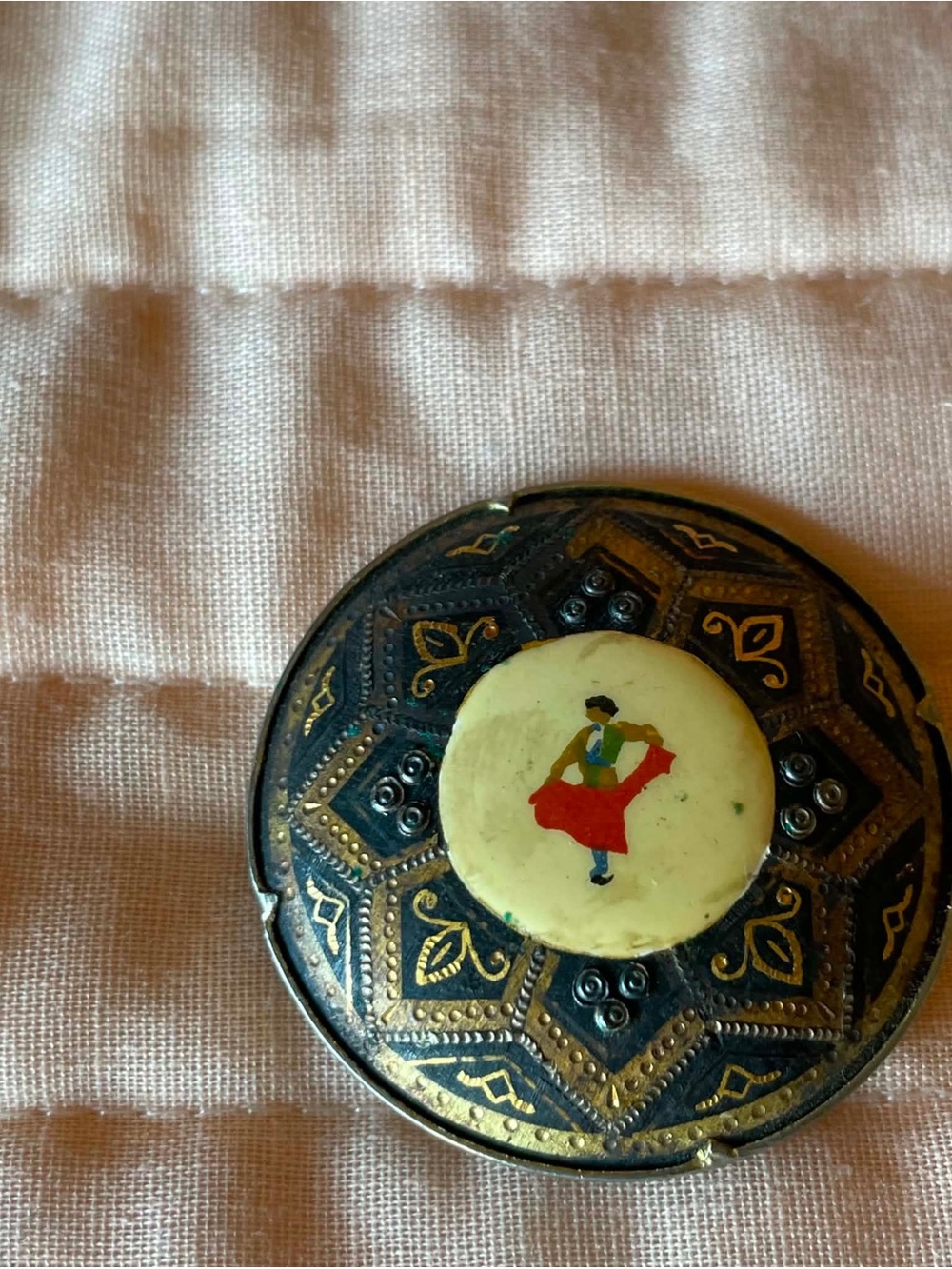 Handcrafted Black and Gold Floral Brooch with Red Accent